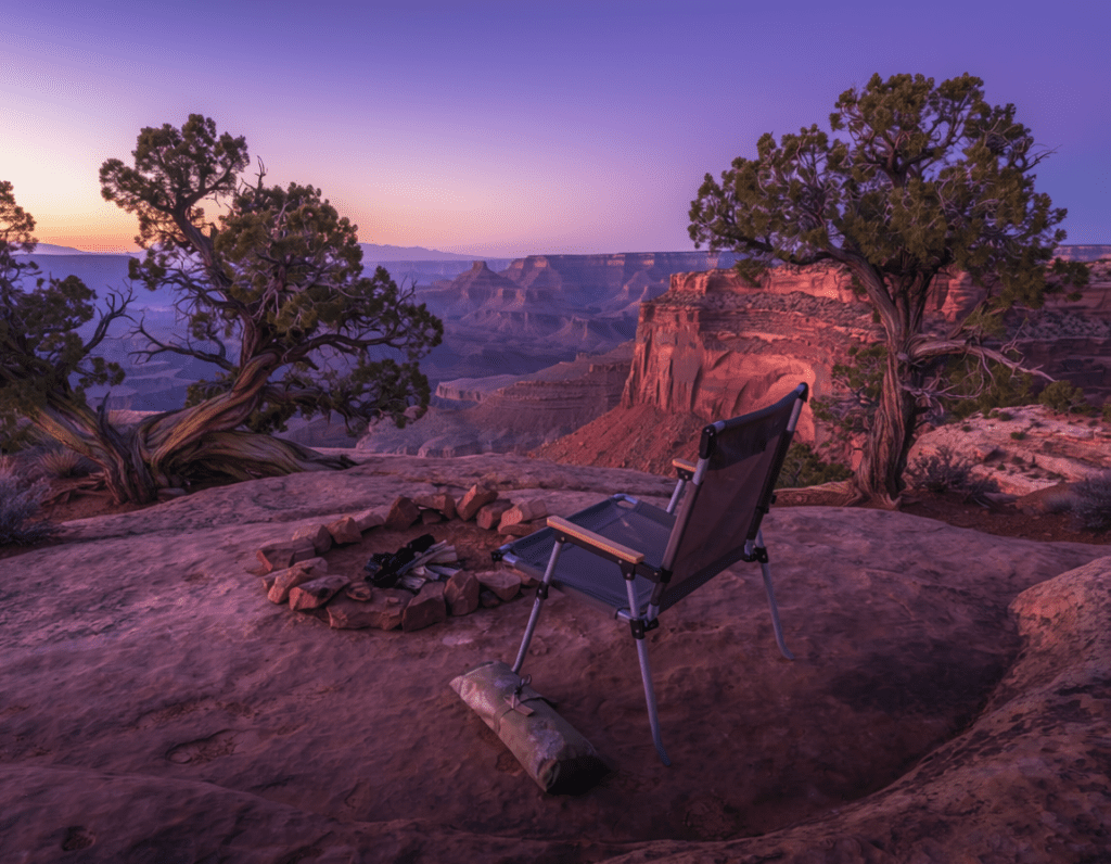 Willow Flat Campground Island in the Sky Canyonlands National Park at dusk, small campsite on mesa top with camp chair facing vast canyon view,